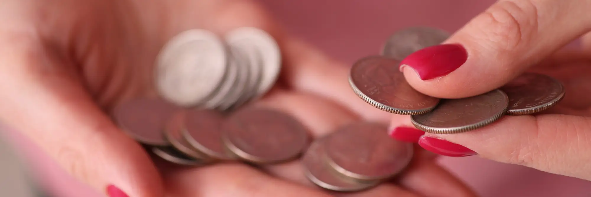 Hand holding coins
